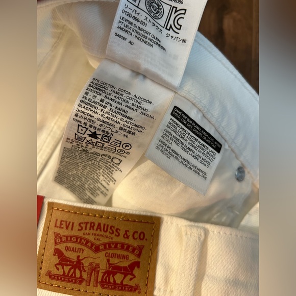 Levi's White Denim Mid Rise Slim Bermuda Shorts - Picture 11 of 15